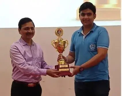 A faculty member and a student holding an ATF trophy together at the BIT Wardha felicitation ceremony