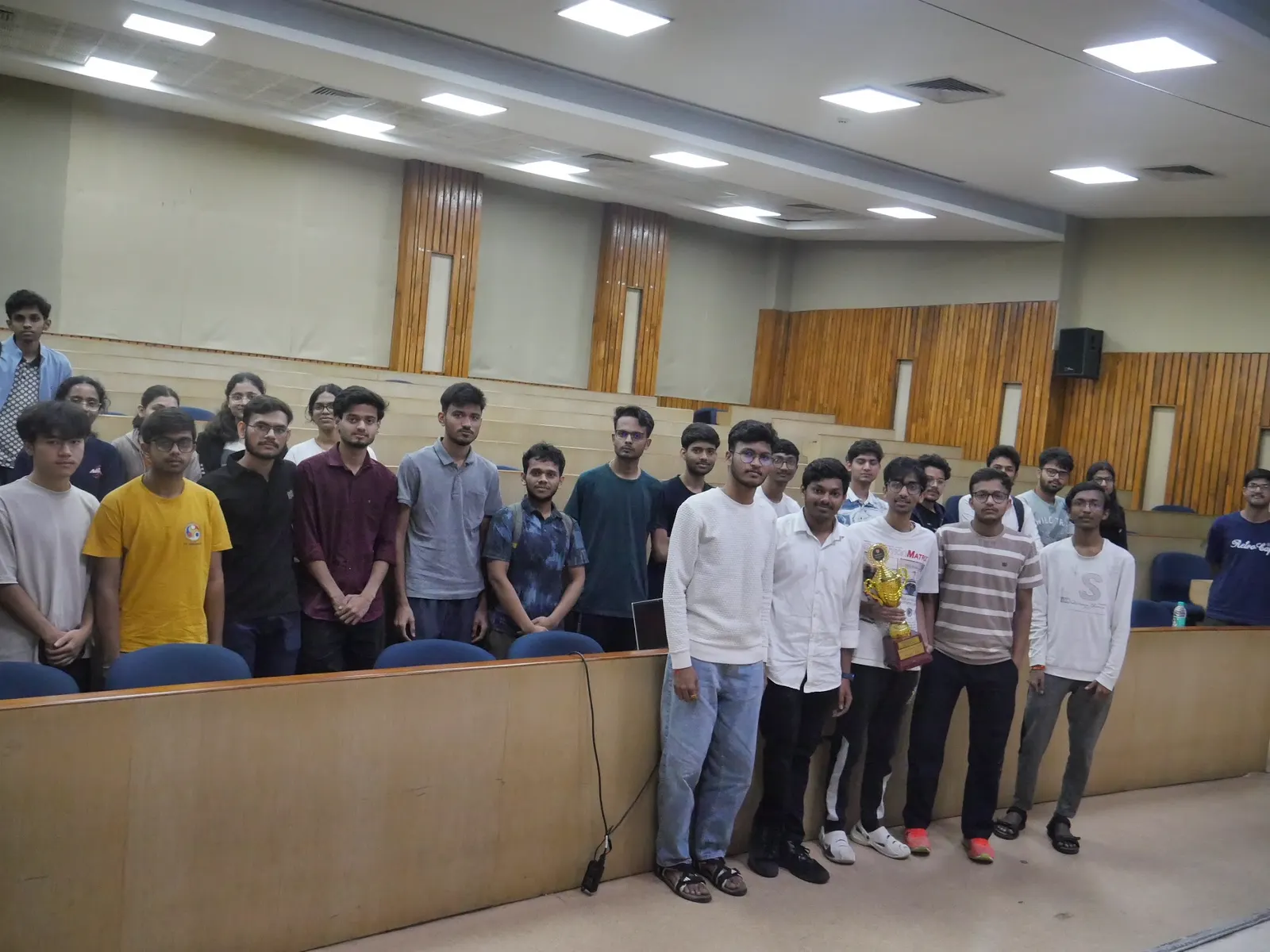 About twenty students standing together on stage at the end of the ATF felicitation ceremony at IIT Guwahati