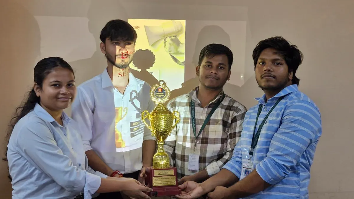 Four ATF fellows holding a trophy together at the NIT Agartala felicitation ceremony