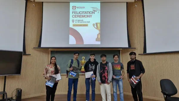 ATF fellows standing with their trophy and goodie bags at the IIT Mandi felicitation ceremony, under a slide naming the A-18 Lecture Hall