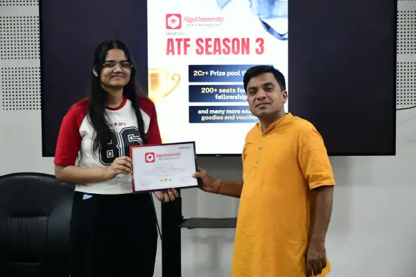 An ATF fellow receiving her certificate from a faculty member in front of an ATF Season 3 banner